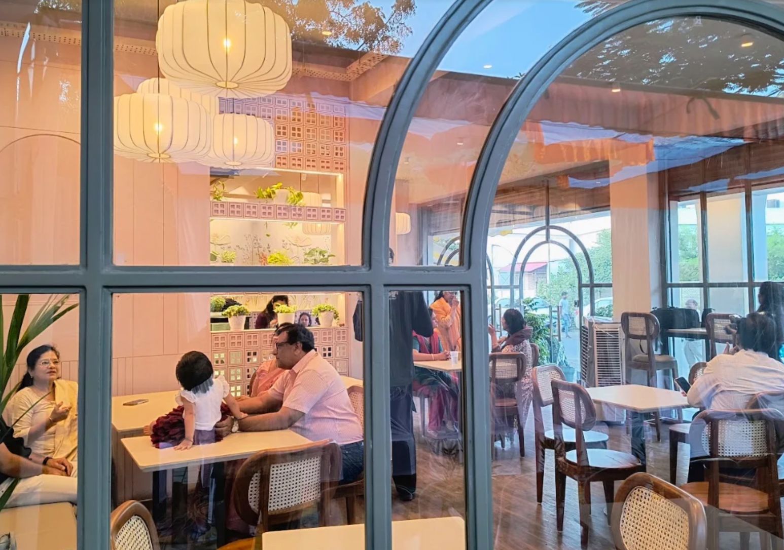 Cafe Dolcezza in Salaiya / Bawadiya Kalan, Bhopal, seen through its arched window